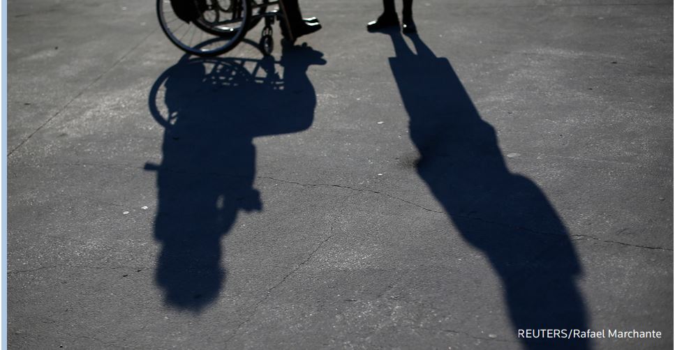 People attend a protest by disabled persons against government austerity measures in front of Finance Ministry in Lisbon