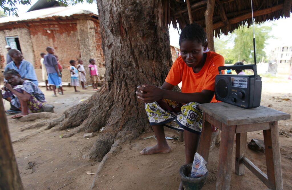 A man listens to a radio to hear news on election results at Mishomoroni area of Kenya's coastal city of Mombasa March 6, 2013. Kenyan authorities were racing to gather final election results on Wednesday REUTERS/Joseph Okanga